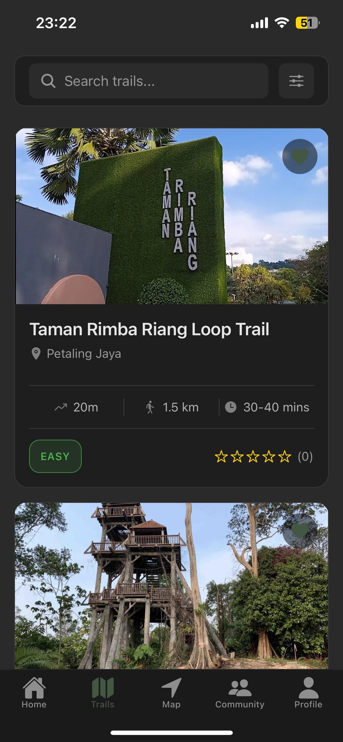 HikeMate trail list showing Taman Rimba Riang Loop Trail in Petaling Jaya with distance, elevation and an easy difficulty rating